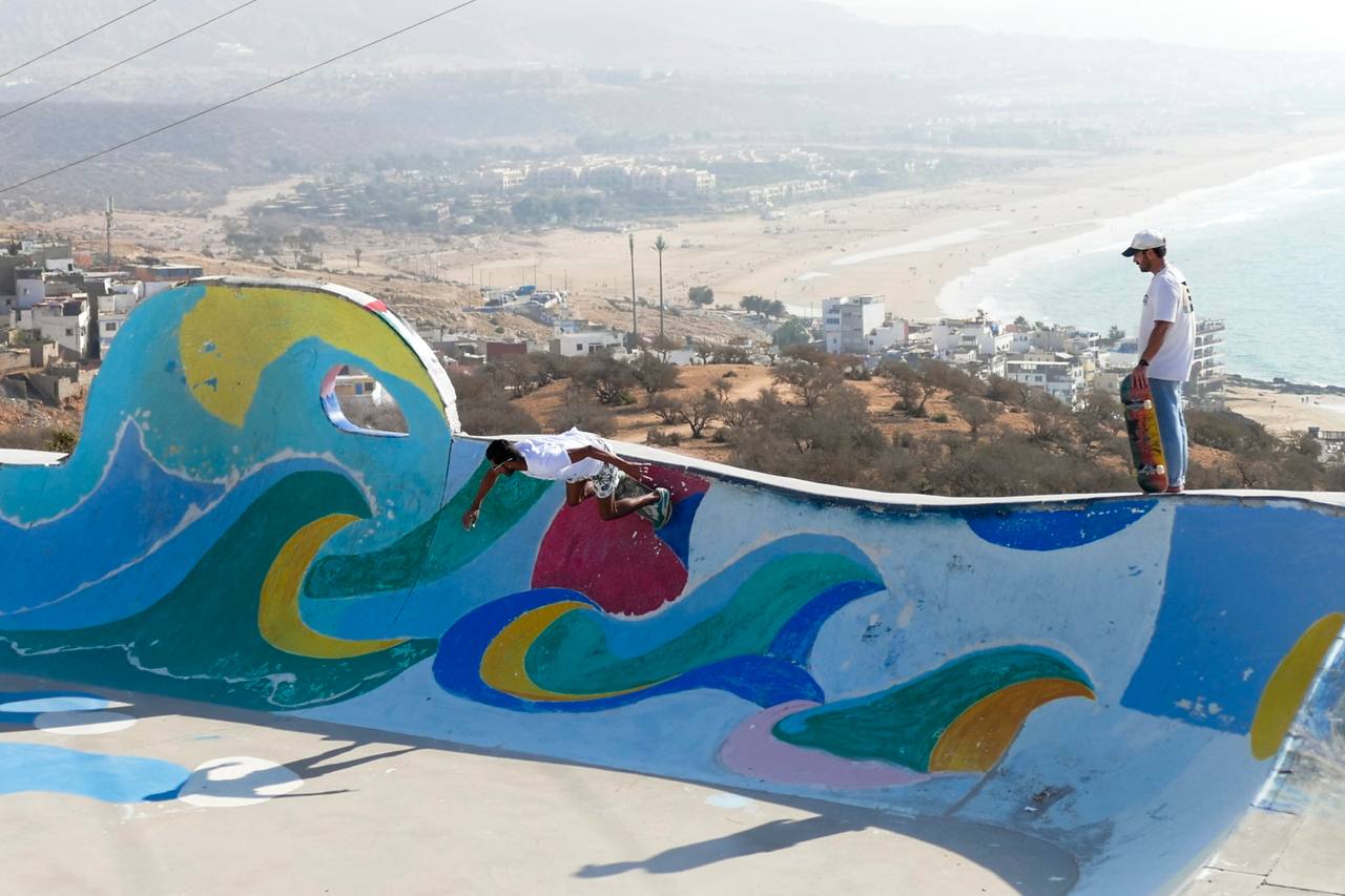 Sunlit Taghazout surf memory with beach and Atlantic horizon